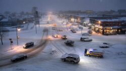 Heavy snow expected starting tonight as authorities warn drivers to stay home while businesses push for normal operations